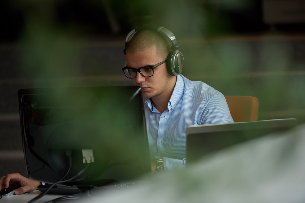 startup business, software developer working on computer at modern office